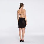 Dalina Mini Mesh Wrap Black Sarong | Moeva | Beachwear Skirts | Each week unveils new pieces—luxury swimwear, fluid resort silhouettes, and elevated summer-to-evening essentials designed to carry you from coastal escapes to city nights.