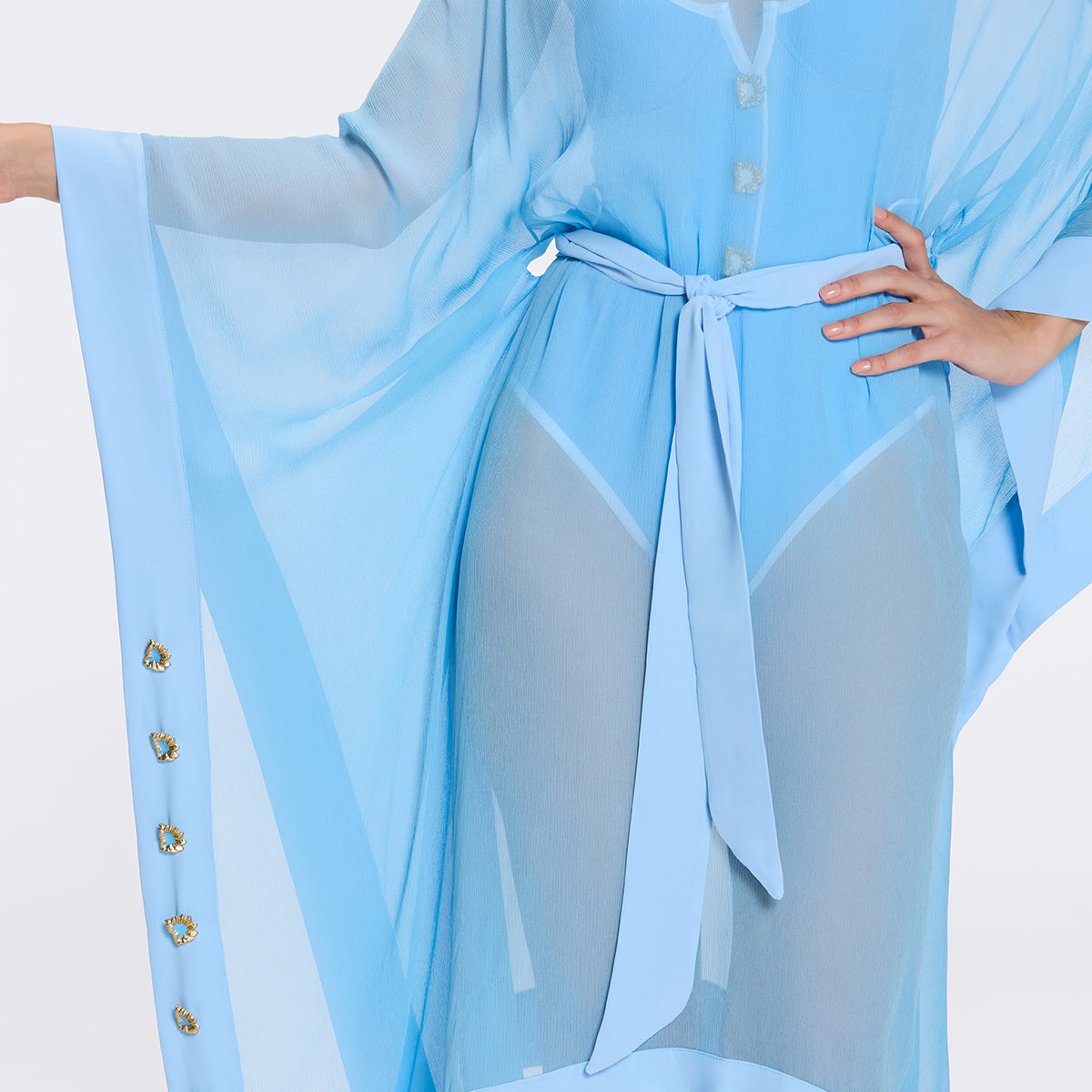Tata Blue Sheer Gold Buttoned Belted Kaftan with Asymmetric Hem | Moeva | Kaftan | Each week unveils new pieces—luxury swimwear, fluid resort silhouettes, and elevated summer-to-evening essentials designed to carry you from coastal escapes to city nights.