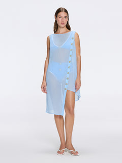 Solianne Blue Sheer Sleeveless Asymmetric Dress with Gold Button Detail | Moeva | Beachwear Dresses | Each week unveils new pieces—luxury swimwear, fluid resort silhouettes, and elevated summer-to-evening essentials designed to carry you from coastal escapes to city nights.