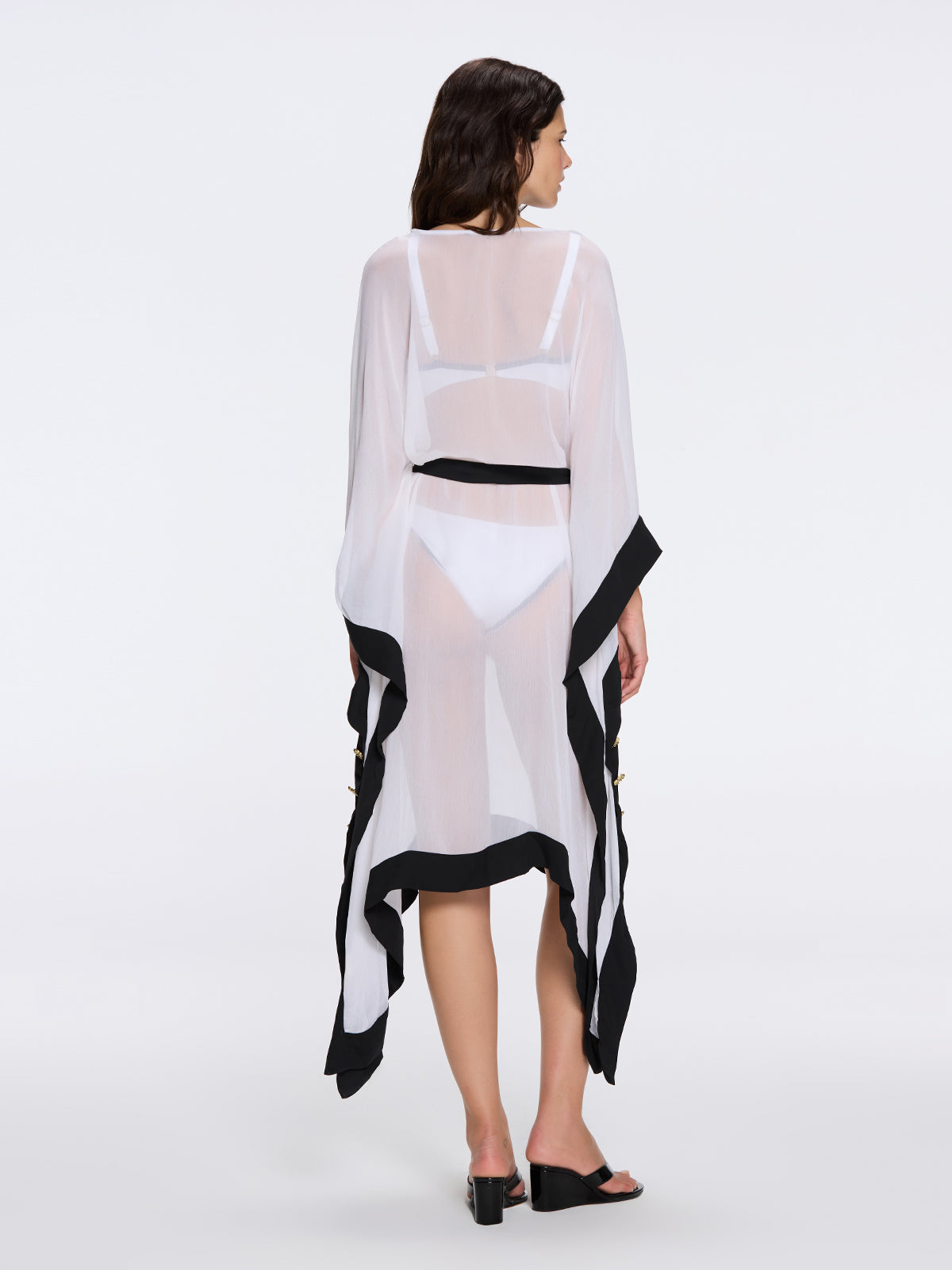 Tata White-Black Sheer Gold Buttoned Belted Kaftan with Asymmetric Hem | Moeva | Kaftan | Each week unveils new pieces—luxury swimwear, fluid resort silhouettes, and elevated summer-to-evening essentials designed to carry you from coastal escapes to city nights.