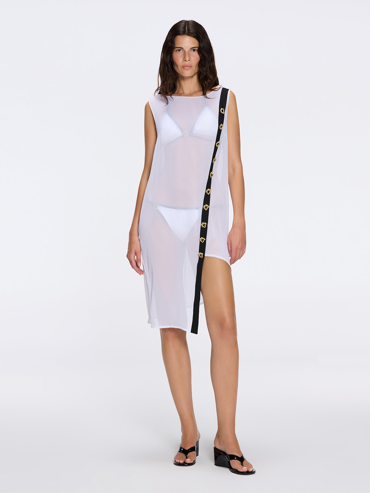 Solianne White Sheer Sleeveless Asymmetric Dress with Gold Button Detail | Moeva | Dress | Each week unveils new pieces—luxury swimwear, fluid resort silhouettes, and elevated summer-to-evening essentials designed to carry you from coastal escapes to city nights.