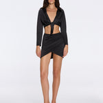 Greta Black Satin Long Sleeve Tie Front Shirt | Moeva | Beachwear Tops | Each week unveils new pieces—luxury swimwear, fluid resort silhouettes, and elevated summer-to-evening essentials designed to carry you from coastal escapes to city nights.