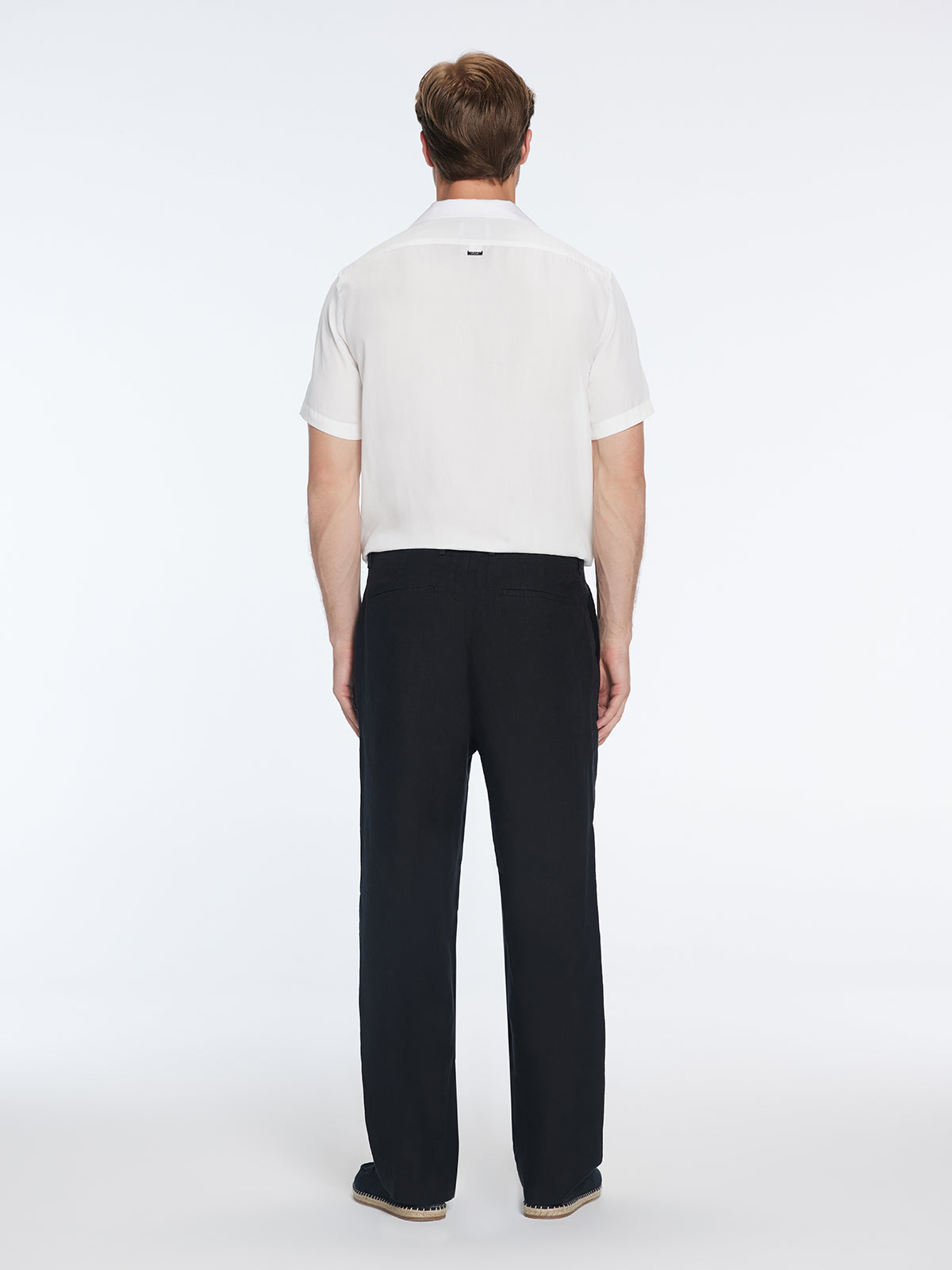 Adrian Black Linen Straight-Leg Pants | Moeva | Pants | Each week unveils new pieces—luxury swimwear, fluid resort silhouettes, and elevated summer-to-evening essentials designed to carry you from coastal escapes to city nights.