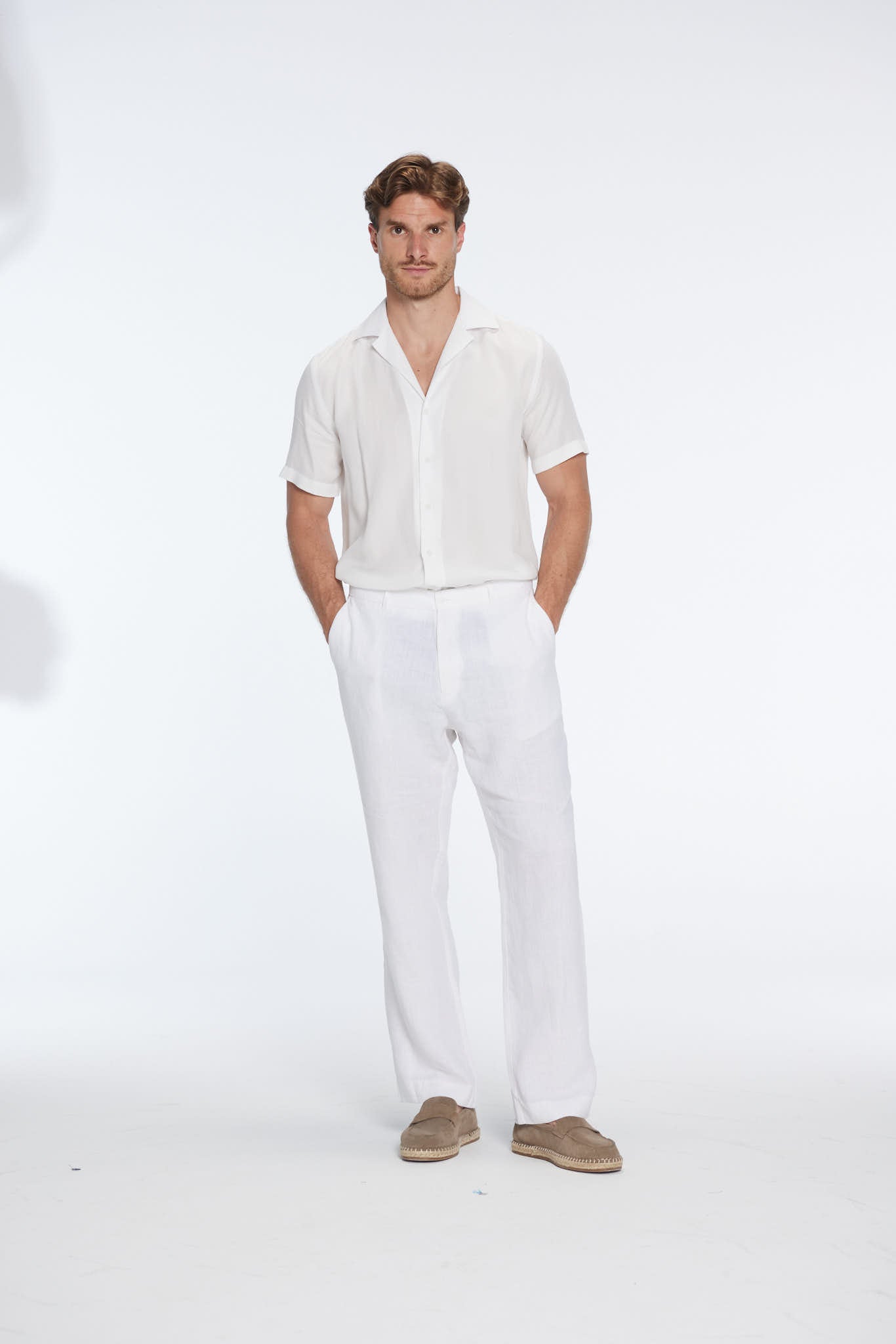 Andres Rasmussen - Harry White Linen Shirt with Spread Collar And Adrian Linen Straight-Leg Pants | Moeva | Set | Each week unveils new pieces—luxury swimwear, fluid resort silhouettes, and elevated summer-to-evening essentials designed to carry you from coastal escapes to city nights.