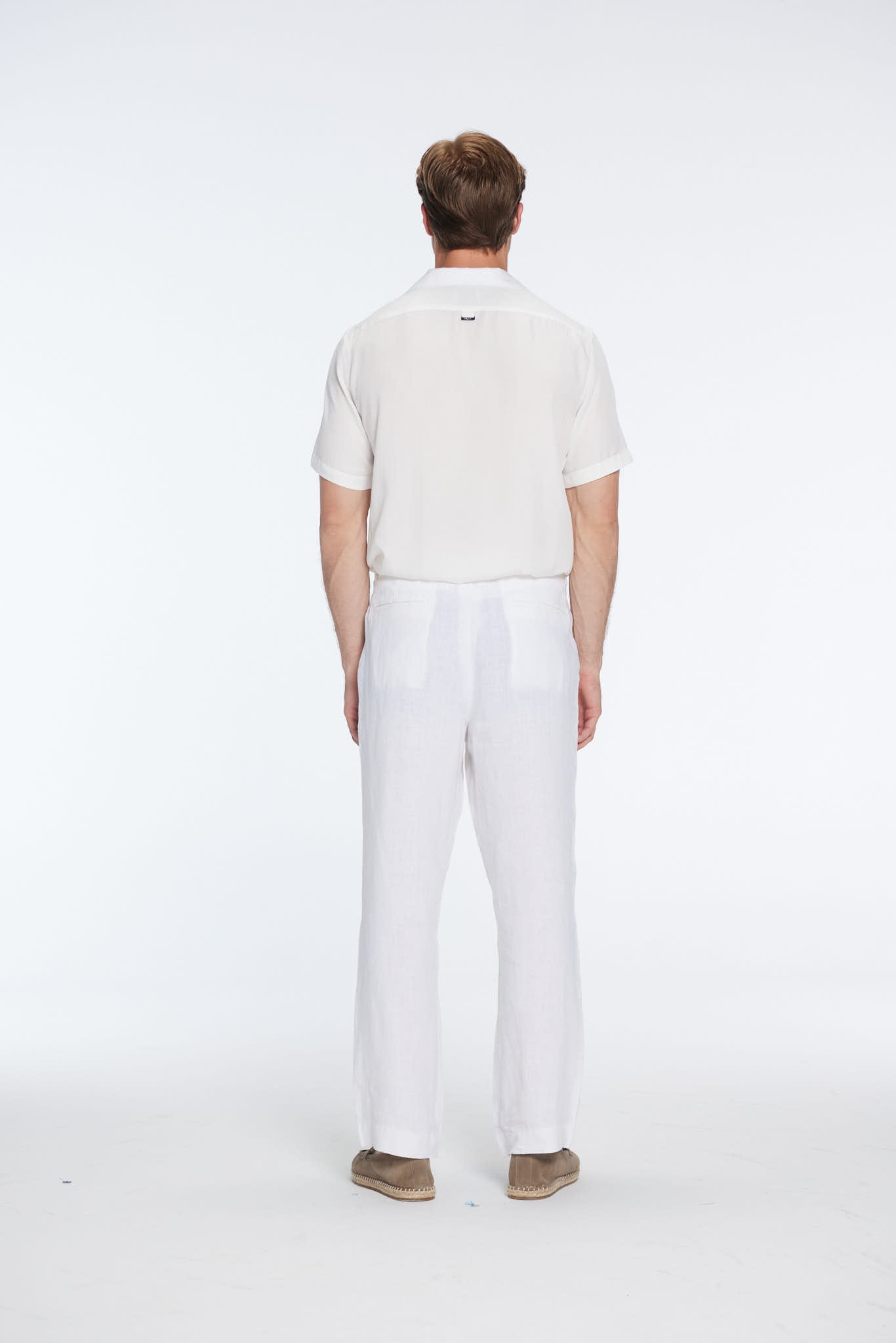 Andres Rasmussen - Harry White Linen Shirt with Spread Collar And Adrian Linen Straight-Leg Pants | Moeva | Set | Each week unveils new pieces—luxury swimwear, fluid resort silhouettes, and elevated summer-to-evening essentials designed to carry you from coastal escapes to city nights.