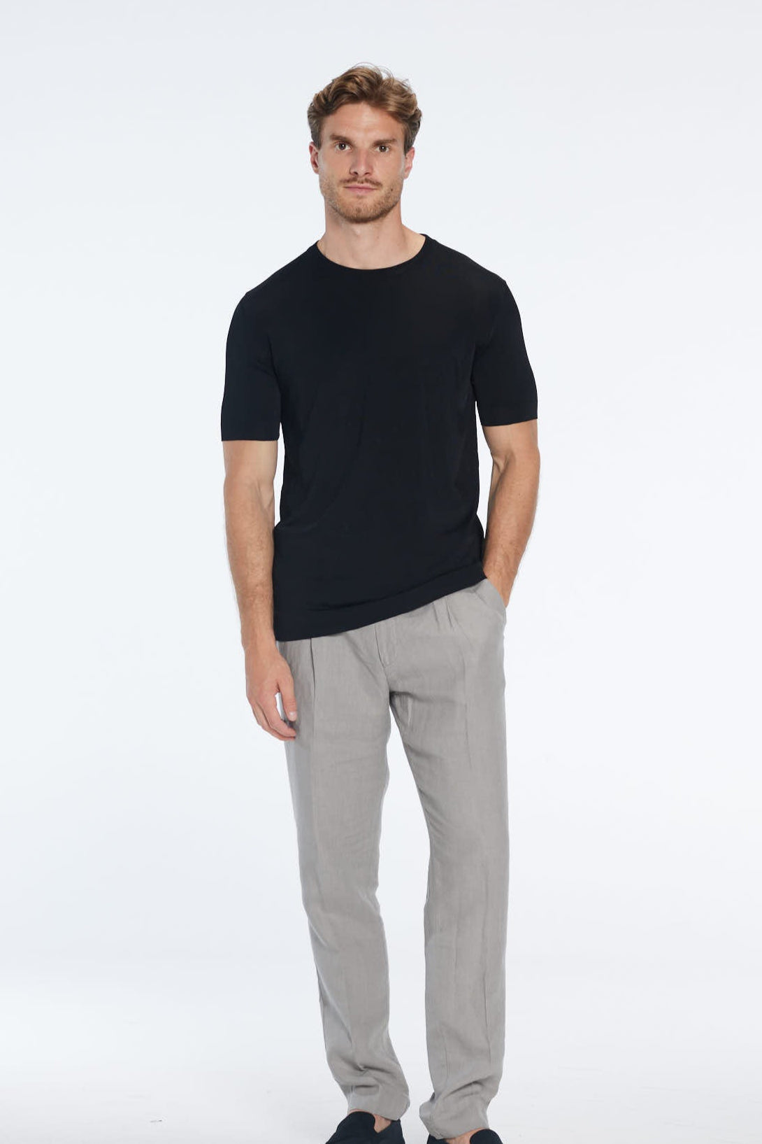 Atlas Black Cotton Round Neck T-Shirt | Moeva | Men Round Neck Shirts | Each week unveils new pieces—luxury swimwear, fluid resort silhouettes, and elevated summer-to-evening essentials designed to carry you from coastal escapes to city nights.