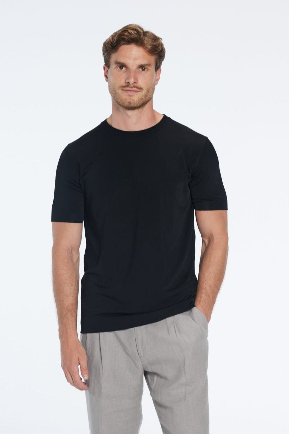 Atlas Black Cotton Round Neck T-Shirt | Moeva | Men Round Neck Shirts | Each week unveils new pieces—luxury swimwear, fluid resort silhouettes, and elevated summer-to-evening essentials designed to carry you from coastal escapes to city nights.