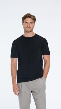 Oscar Black Round Neck T-Shirt | Moeva | T-Shirt | Each week unveils new pieces—luxury swimwear, fluid resort silhouettes, and elevated summer-to-evening essentials designed to carry you from coastal escapes to city nights.