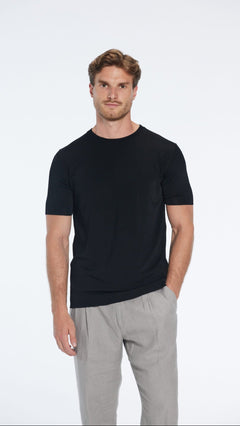 Oscar Black Round Neck T-Shirt | Moeva | Men Round Neck Shirts | Each week unveils new pieces—luxury swimwear, fluid resort silhouettes, and elevated summer-to-evening essentials designed to carry you from coastal escapes to city nights.