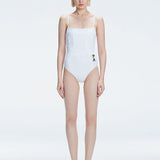 "Model wearing the Marigold White Swimsuit from the Synersphere SS25 collection, with a square neckline and boned torso."
