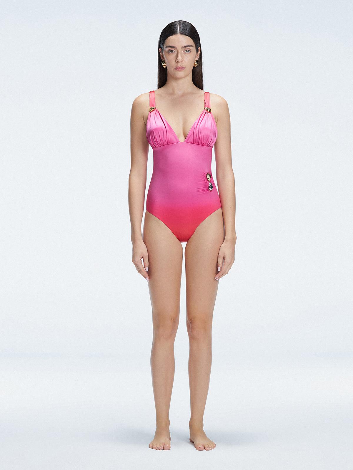 Front view of model wearing Marina Degraded Red-Pink One Piece swimsuit with halter neck and ruched waist detail.
