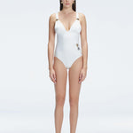 Front view of model wearing Marina Degraded White One Piece swimsuit with halter neck and ruched waist detail.
