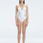 Front view of model wearing Marina Degraded White One Piece swimsuit with halter neck and ruched waist detail.
