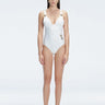 Front view of model wearing Marina Degraded White One Piece swimsuit with halter neck and ruched waist detail.
