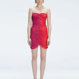 Model showcasing the Marsiela Red  Sonar Dress, highlighting the strapless design and flattering ruched detail.