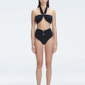 "Model wearing the Meredith Black Halter Neck Bikini Set with buckle detail and removable padding.
