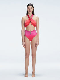 "Model wearing the Meredith Gradient Halter Neck Bikini Top with buckle detail and removable padding, standing by the pool."
