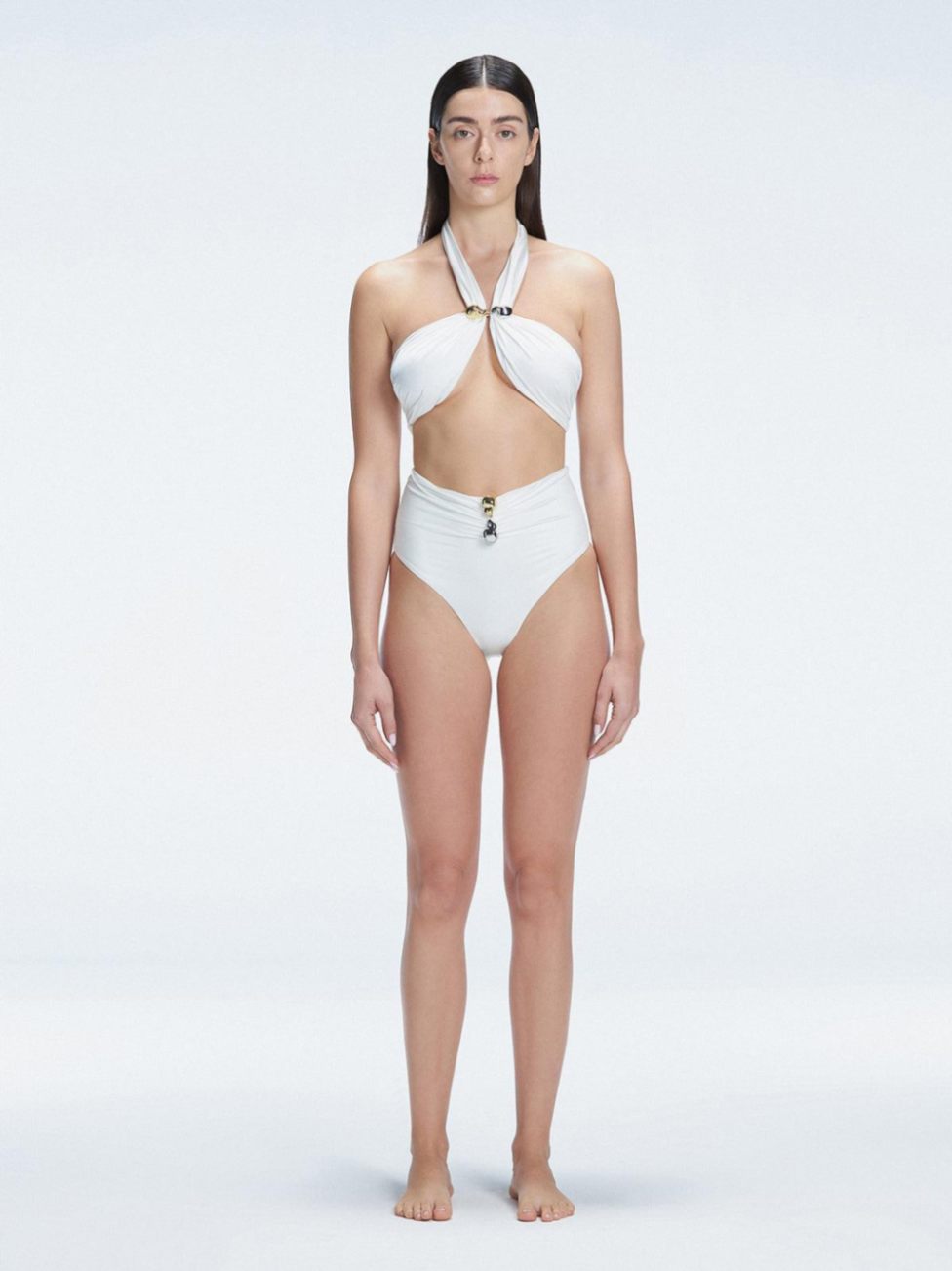 "Model wearing the Meredith White Halter Neck Bikini Set with buckle detail and removable padding "
