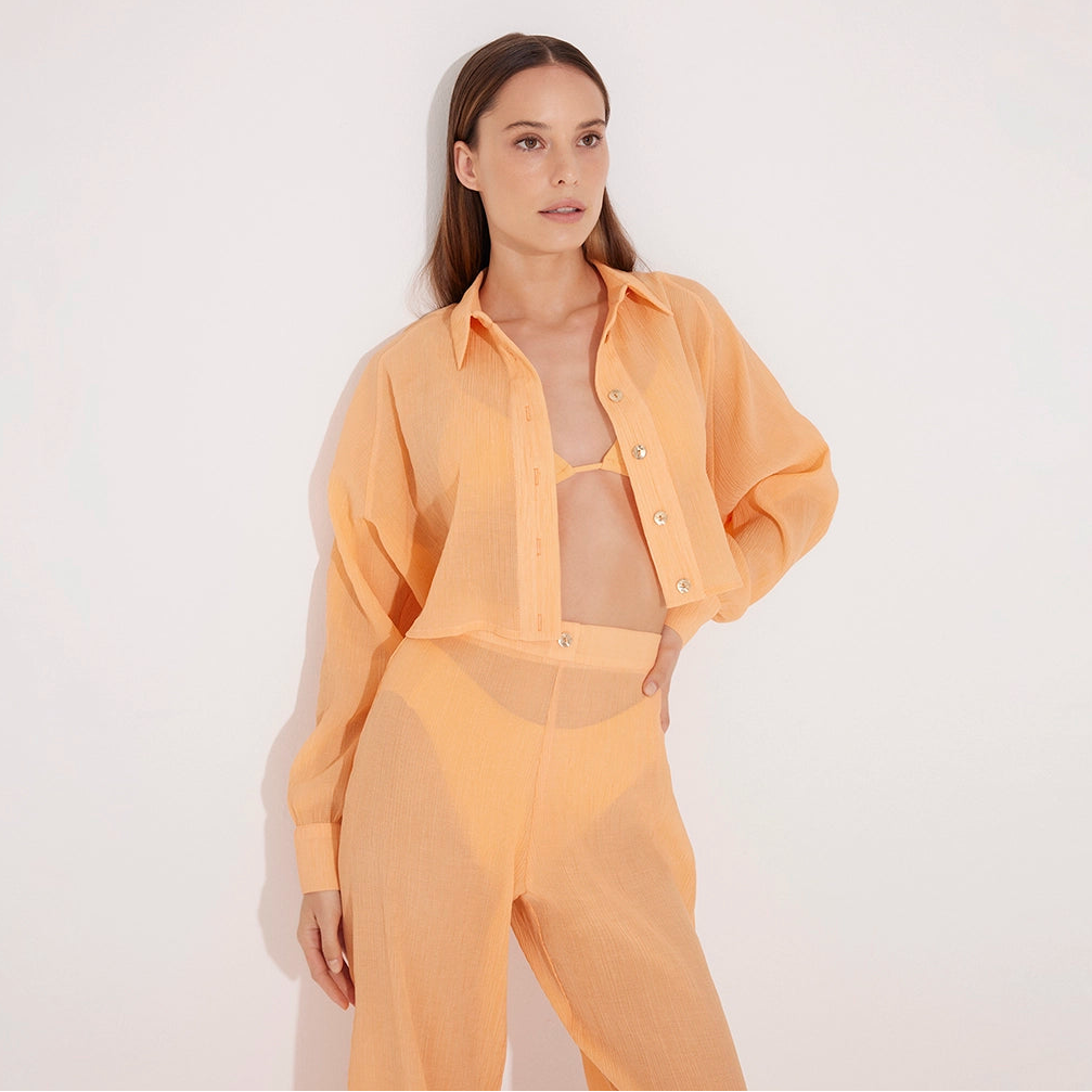 Jacinta Orange Cropped Sheer Long Sleeve Shirt | Moeva | Shirt | Each week unveils new pieces—luxury swimwear, fluid resort silhouettes, and elevated summer-to-evening essentials designed to carry you from coastal escapes to city nights.