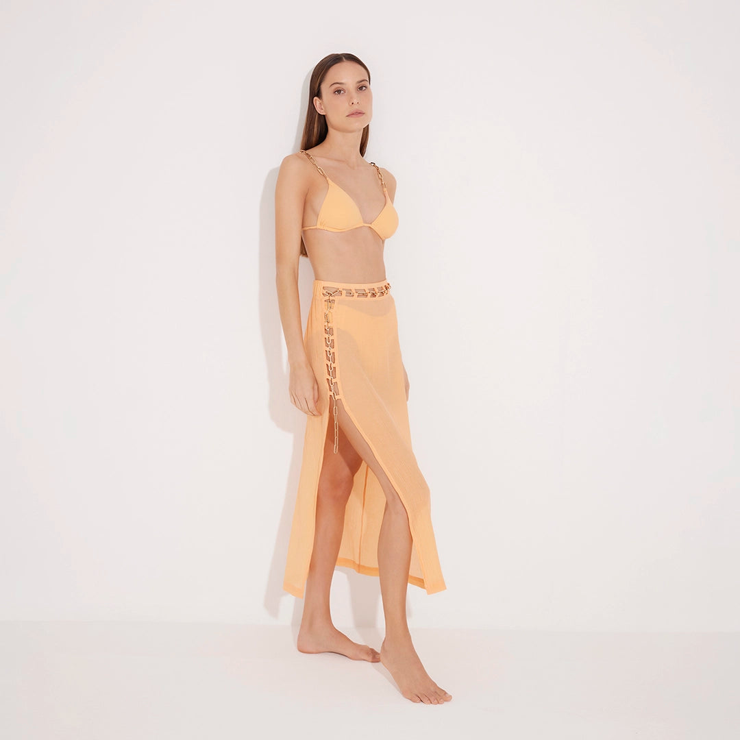 Maritza Orange Sheer High-Rise Skirt with Gold Chain Belt | Moeva | Beachwear Skirts | Each week unveils new pieces—luxury swimwear, fluid resort silhouettes, and elevated summer-to-evening essentials designed to carry you from coastal escapes to city nights.