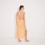 Maritza Orange Sheer High-Rise Skirt with Gold Chain Belt | Moeva | Beachwear Skirts | Each week unveils new pieces—luxury swimwear, fluid resort silhouettes, and elevated summer-to-evening essentials designed to carry you from coastal escapes to city nights.