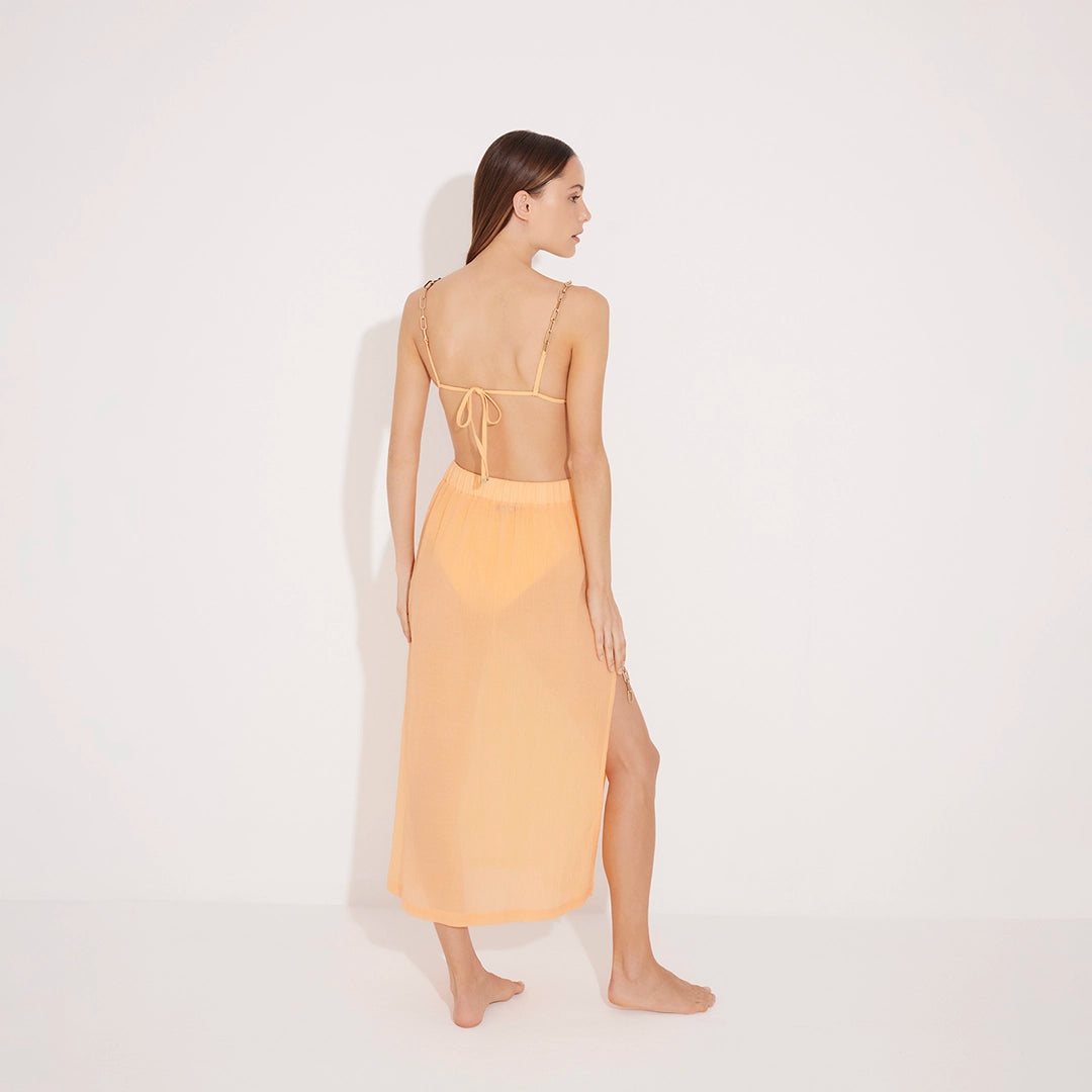 Maritza Orange Sheer High-Rise Skirt with Gold Chain Belt | Moeva | Beachwear Skirts | Each week unveils new pieces—luxury swimwear, fluid resort silhouettes, and elevated summer-to-evening essentials designed to carry you from coastal escapes to city nights.