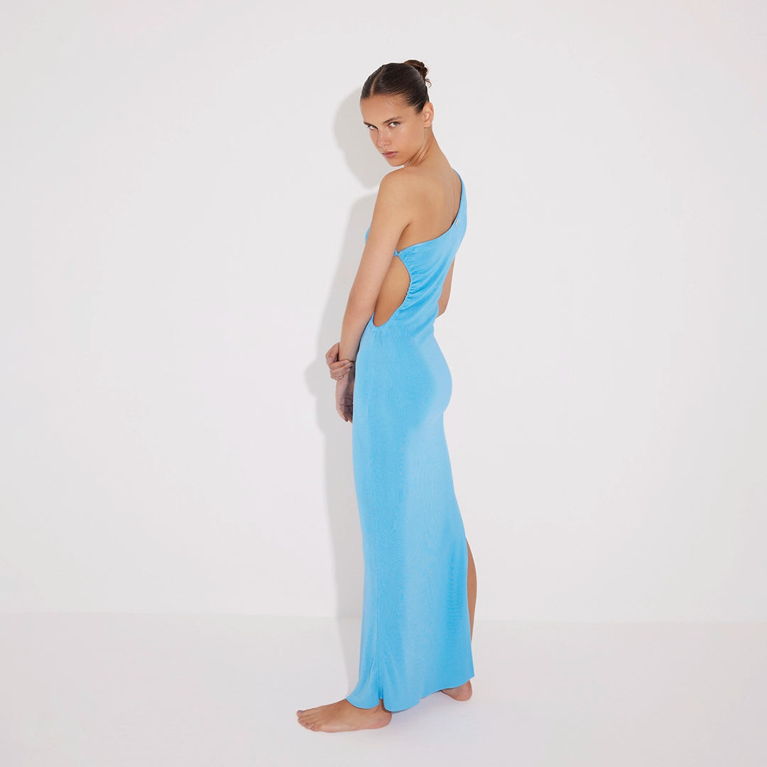 Fewa Blue One-Shoulder Knitted Maxi Dress with Side Cut-Out Detail | Moeva | RTW Dresses | Each week unveils new pieces—luxury swimwear, fluid resort silhouettes, and elevated summer-to-evening essentials designed to carry you from coastal escapes to city nights.