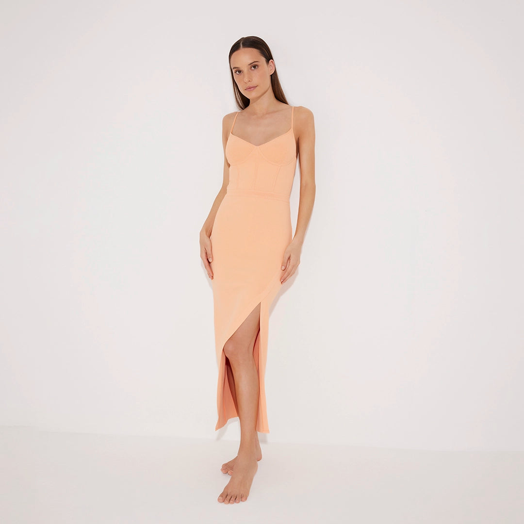 Beau Orange Sleeveless Knitted Long Dress with Side Slit | Moeva | RTW Dresses | Each week unveils new pieces—luxury swimwear, fluid resort silhouettes, and elevated summer-to-evening essentials designed to carry you from coastal escapes to city nights.