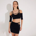 Ontario Black Knitted Cut-Out Skirt | Moeva | Beachwear Skirts | Each week unveils new pieces—luxury swimwear, fluid resort silhouettes, and elevated summer-to-evening essentials designed to carry you from coastal escapes to city nights.