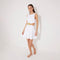 Lanao White Cut-Out Knit Mini Dress with Gold Detail | Moeva | RTW Dresses | Each week unveils new pieces—luxury swimwear, fluid resort silhouettes, and elevated summer-to-evening essentials designed to carry you from coastal escapes to city nights.