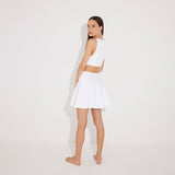 Lanao White Cut-Out Knit Mini Dress with Gold Detail | Moeva | RTW Dresses | Each week unveils new pieces—luxury swimwear, fluid resort silhouettes, and elevated summer-to-evening essentials designed to carry you from coastal escapes to city nights.