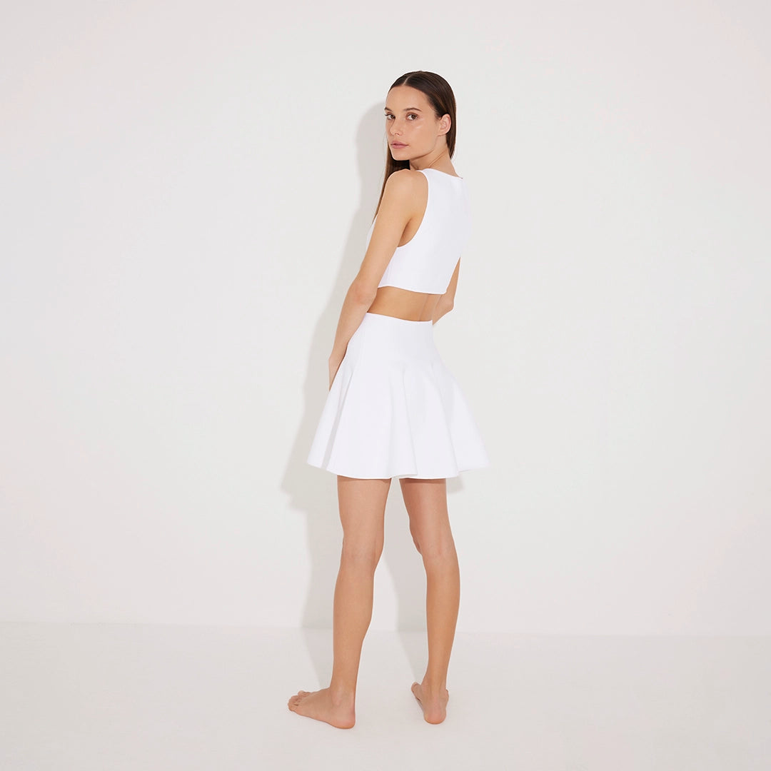 Lanao White Cut-Out Knit Mini Dress with Gold Detail | Moeva | RTW Dresses | Each week unveils new pieces—luxury swimwear, fluid resort silhouettes, and elevated summer-to-evening essentials designed to carry you from coastal escapes to city nights.