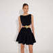 Lanao Black Cut-Out Knit Mini Dress with Gold Detail | Moeva | RTW Dresses | Each week unveils new pieces—luxury swimwear, fluid resort silhouettes, and elevated summer-to-evening essentials designed to carry you from coastal escapes to city nights.