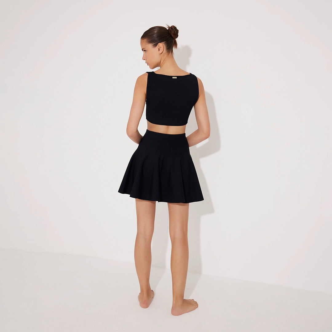 Lanao Black Cut-Out Knit Mini Dress with Gold Detail | Moeva | RTW Dresses | Each week unveils new pieces—luxury swimwear, fluid resort silhouettes, and elevated summer-to-evening essentials designed to carry you from coastal escapes to city nights.