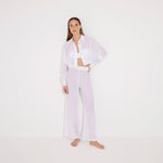 Jacinta White Cropped Sheer Long Sleeve Shirt and Aura White High Waist Beach Pants | Moeva | Shirt and Pants | Each week unveils new pieces—luxury swimwear, fluid resort silhouettes, and elevated summer-to-evening essentials designed to carry you from coastal escapes to city nights.