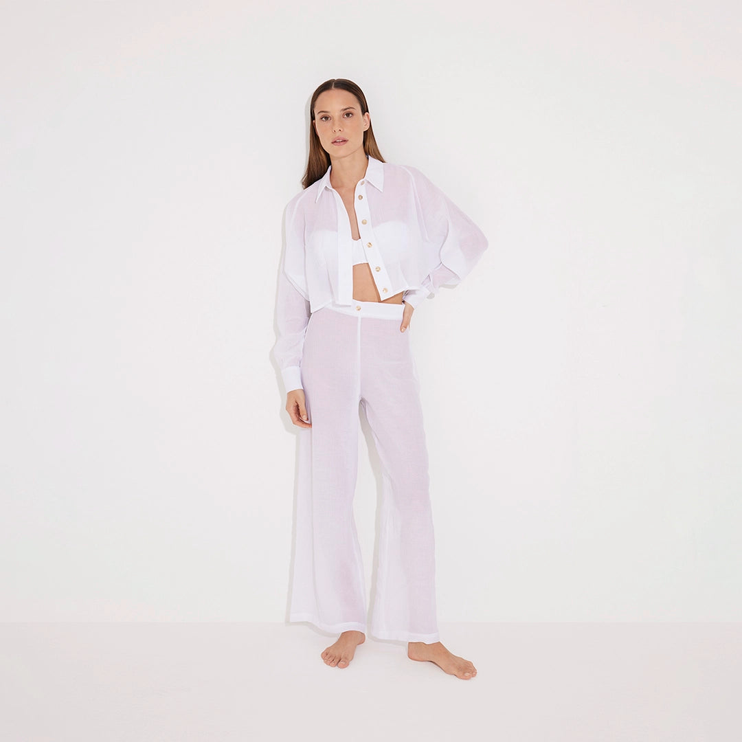 Jacinta White Cropped Sheer Long Sleeve Shirt and Aura White High Waist Beach Pants | Moeva | Shirt and Pants | Each week unveils new pieces—luxury swimwear, fluid resort silhouettes, and elevated summer-to-evening essentials designed to carry you from coastal escapes to city nights.