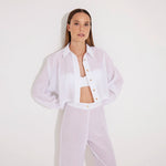 Jacinta White Cropped Sheer Long Sleeve Shirt and Aura White High Waist Beach Pants | Moeva | Shirt and Pants | Each week unveils new pieces—luxury swimwear, fluid resort silhouettes, and elevated summer-to-evening essentials designed to carry you from coastal escapes to city nights.