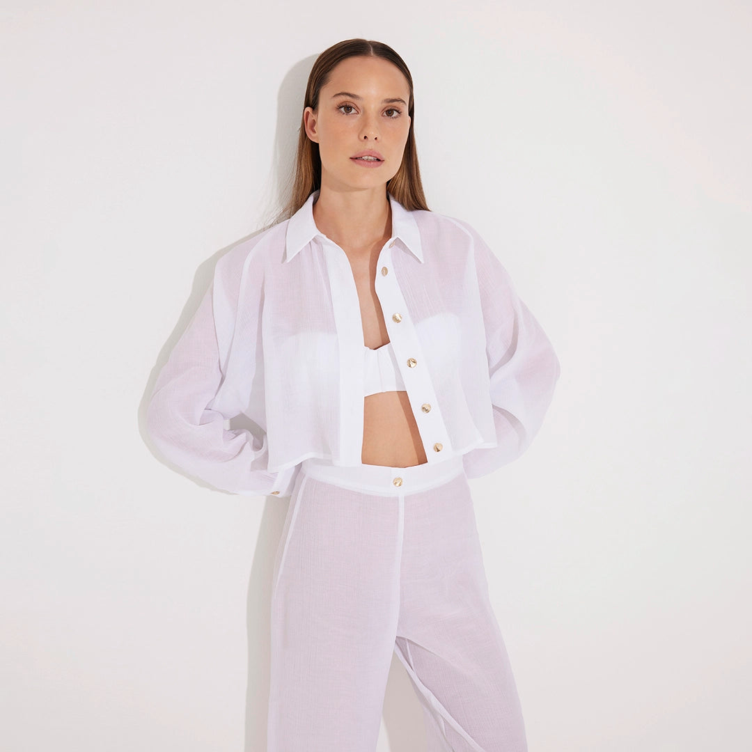 Jacinta White Cropped Sheer Long Sleeve Shirt and Aura White High Waist Beach Pants | Moeva | Shirt and Pants | Each week unveils new pieces—luxury swimwear, fluid resort silhouettes, and elevated summer-to-evening essentials designed to carry you from coastal escapes to city nights.