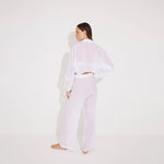 Jacinta White Cropped Sheer Long Sleeve Shirt and Aura White High Waist Beach Pants | Moeva | Shirt and Pants | Each week unveils new pieces—luxury swimwear, fluid resort silhouettes, and elevated summer-to-evening essentials designed to carry you from coastal escapes to city nights.