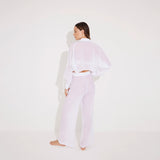 Jacinta White Cropped Sheer Long Sleeve Shirt and Aura White High Waist Beach Pants | Moeva | Shirt and Pants | Each week unveils new pieces—luxury swimwear, fluid resort silhouettes, and elevated summer-to-evening essentials designed to carry you from coastal escapes to city nights.