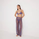 Luz Lilac Metallic Sheer Knit Pants | Moeva | Women Beachwear Pants | Each week unveils new pieces—luxury swimwear, fluid resort silhouettes, and elevated summer-to-evening essentials designed to carry you from coastal escapes to city nights.