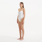 Muriel White Scoop Neck Textured Swimsuit | Moeva | Swimsuit | Each week unveils new pieces—luxury swimwear, fluid resort silhouettes, and elevated summer-to-evening essentials designed to carry you from coastal escapes to city nights.