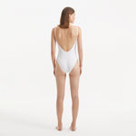 Muriel White Scoop Neck Textured Swimsuit | Moeva | Swimsuit | Each week unveils new pieces—luxury swimwear, fluid resort silhouettes, and elevated summer-to-evening essentials designed to carry you from coastal escapes to city nights.
