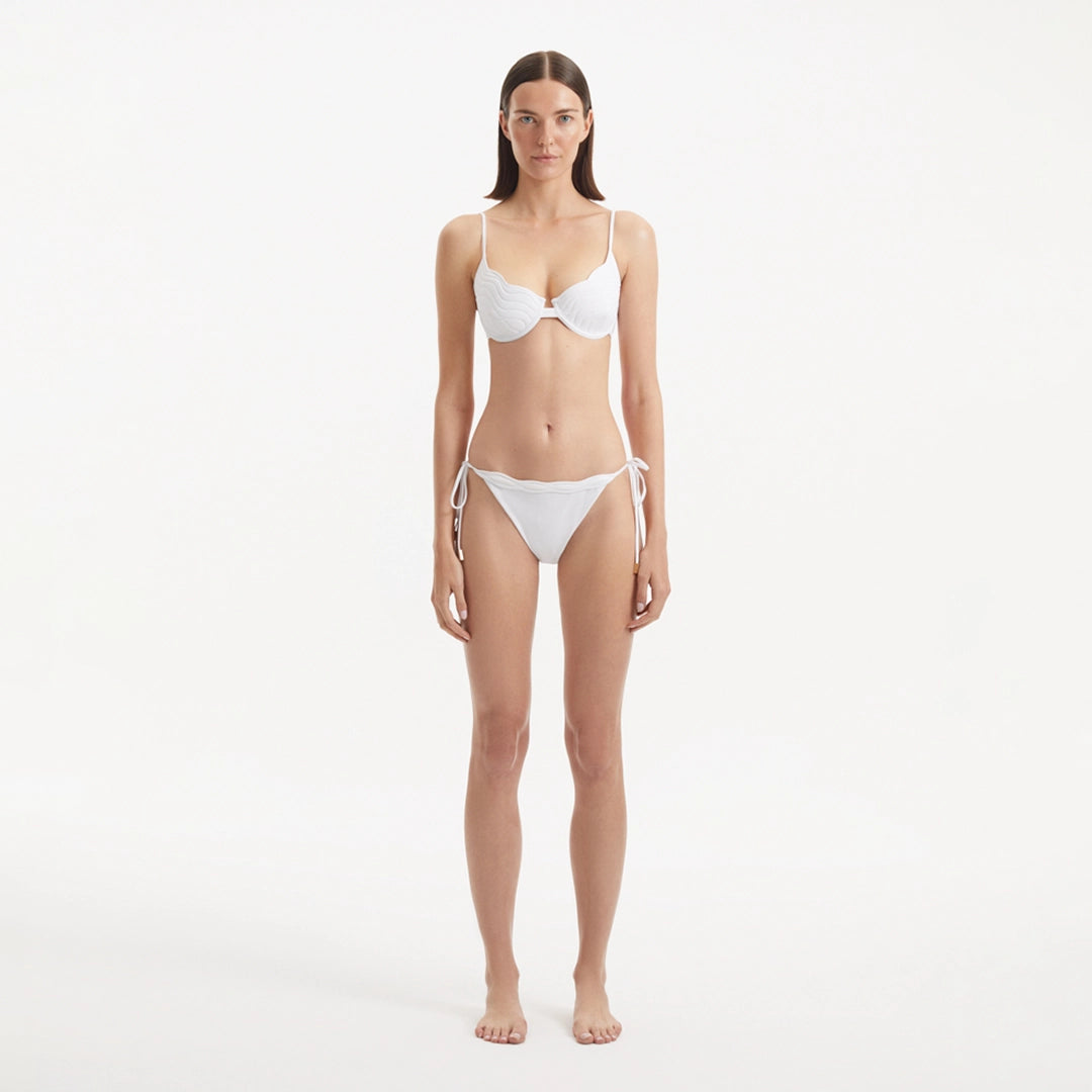 Salila White Underwired Side Tie Wave Textured Bikini Set | Moeva | | Each week unveils new pieces—luxury swimwear, fluid resort silhouettes, and elevated summer-to-evening essentials designed to carry you from coastal escapes to city nights.