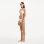 Salila White Underwired Side Tie Wave Textured Bikini Set | Moeva | | Each week unveils new pieces—luxury swimwear, fluid resort silhouettes, and elevated summer-to-evening essentials designed to carry you from coastal escapes to city nights.