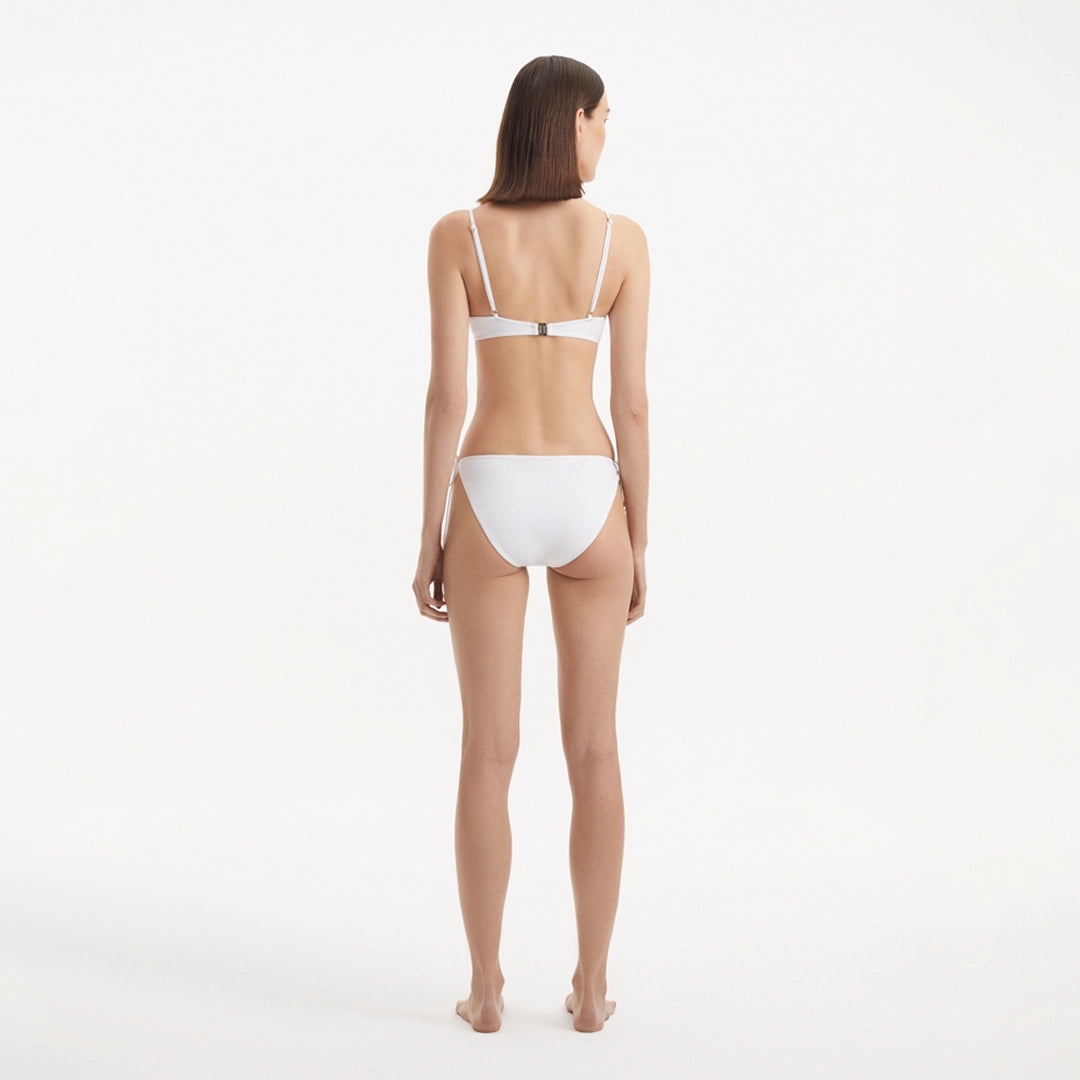 Salila White Underwired Side Tie Wave Textured Bikini Set | Moeva | | Each week unveils new pieces—luxury swimwear, fluid resort silhouettes, and elevated summer-to-evening essentials designed to carry you from coastal escapes to city nights.
