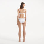 Salila White Underwired Side Tie Wave Textured Bikini Set | Moeva | | Each week unveils new pieces—luxury swimwear, fluid resort silhouettes, and elevated summer-to-evening essentials designed to carry you from coastal escapes to city nights.