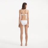 Salila White Underwired Side Tie Wave Textured Bikini Set | Moeva | | Each week unveils new pieces—luxury swimwear, fluid resort silhouettes, and elevated summer-to-evening essentials designed to carry you from coastal escapes to city nights.