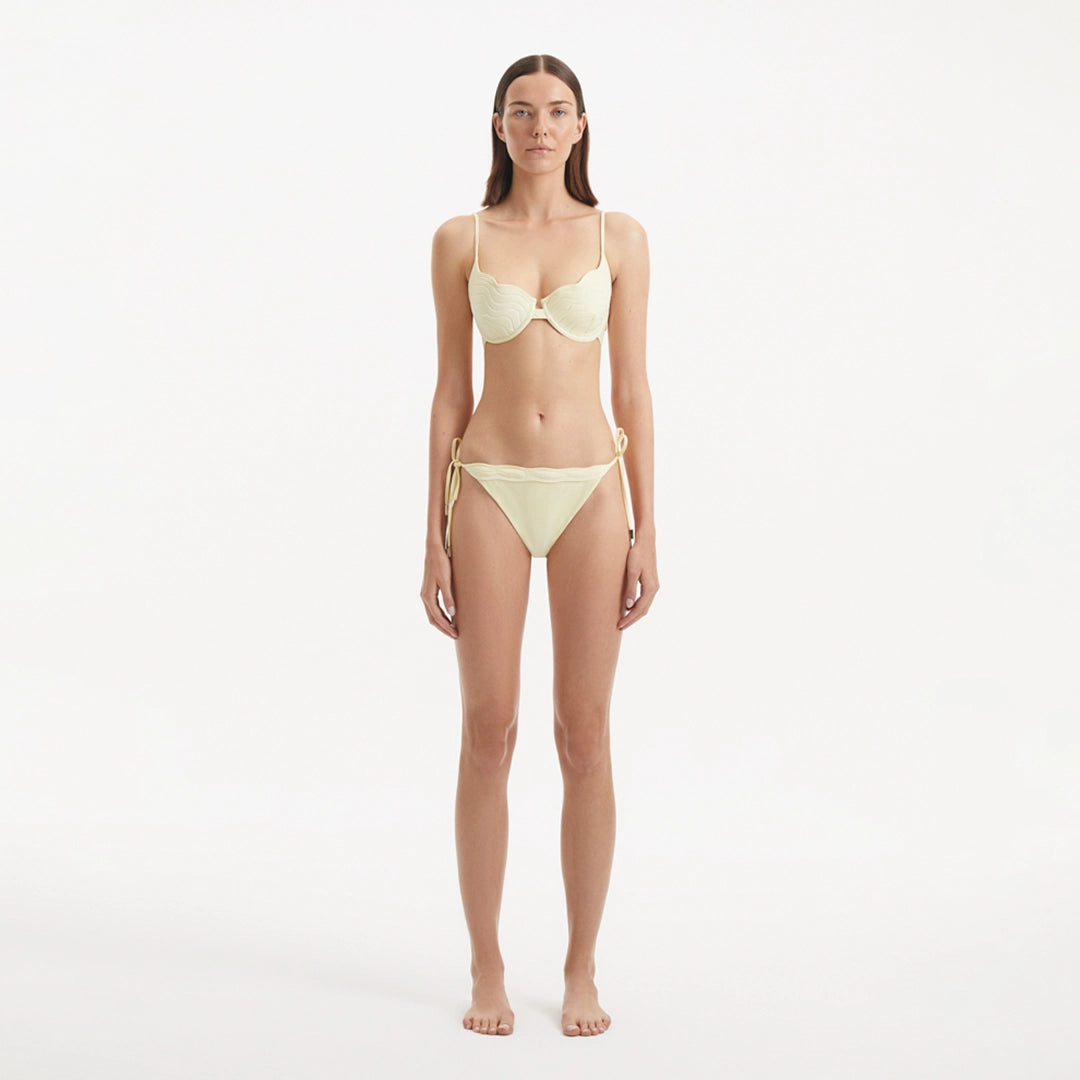 Salila Yellow Underwired Side Tie Wave Textured Bikini Set | Moeva | | Each week unveils new pieces—luxury swimwear, fluid resort silhouettes, and elevated summer-to-evening essentials designed to carry you from coastal escapes to city nights.