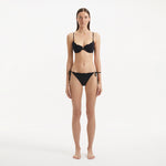 Salila Black Underwired Side Tie Wave Textured Bikini Set | Moeva | | Each week unveils new pieces—luxury swimwear, fluid resort silhouettes, and elevated summer-to-evening essentials designed to carry you from coastal escapes to city nights.
